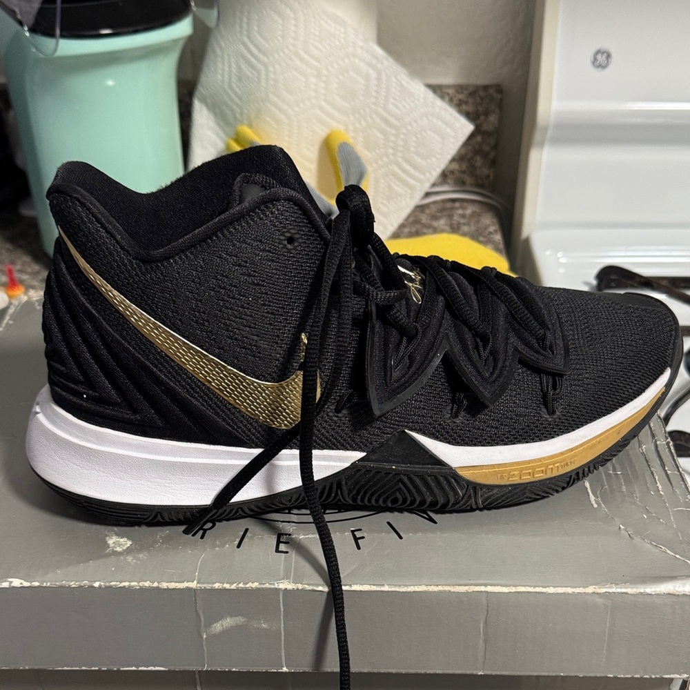 Nike men’s Black and Gold Athletic Shoes